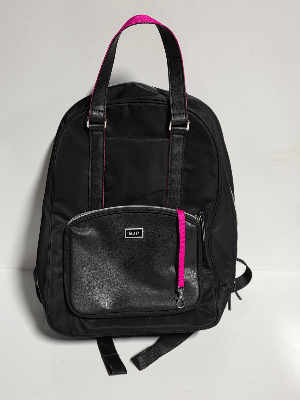 SJP Black Nylon and Faux Leather Backpack with Pink Trim Zipper Accent and Front Pocket