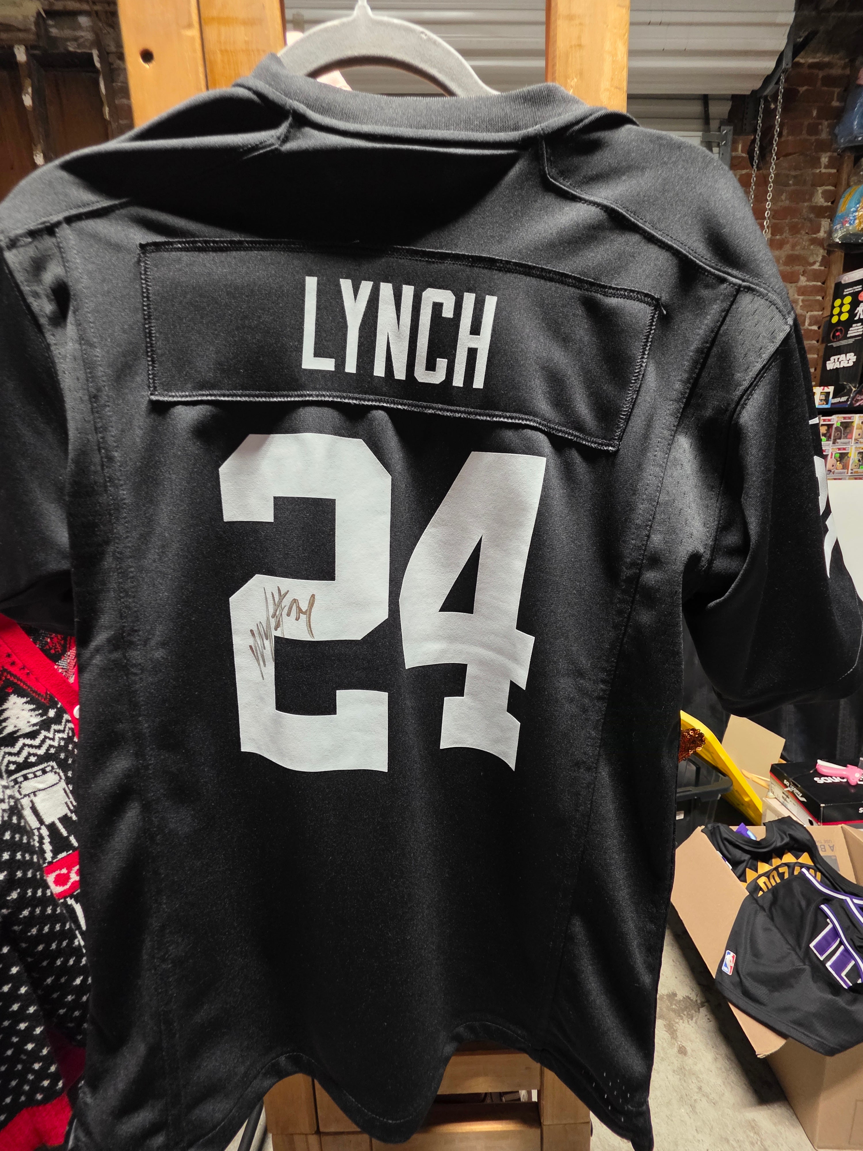 Marshawn Lynch Autographed Signed Las Vegas Raiders Youth Large Football Jersey On Field